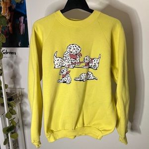 Vintage bright yellow crewneck sweatshirt with dalmatians playing with bandanas.